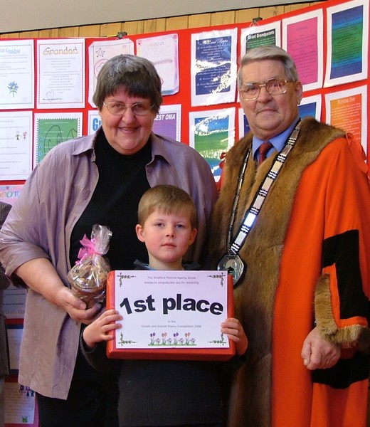Jack Manley, prize winner, with his grandmother and District Mayor John Edwards
